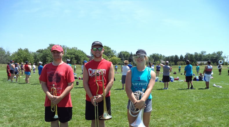 Sam Brewster, a senior; Brice Hall, a junior, and Darcy Brodehl, a sophomore, play in the brass section for Miamisburg High School Marching Band. CONTRIBUTED
