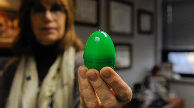 Vera Bowie, Violence Prevention Integrator, holds up one of the green eggs that will be hidden all over Wright-Patterson for this year’s Spring Fling egg hunt. The hunt will be held from March 12-23 all over Area A and Area B. (U.S. Air Force photo/SSgt Ashley Clingerman)