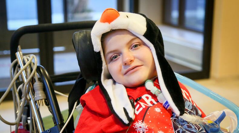 All Andrew Little, 8, wants for Christmas is enough holiday cards to cover the walls of his room at St. Joseph Home in Sharonville, and share them with his friends at the facility for wheelchair-bound people with complex medical needs. GREG LYNCH / STAFF