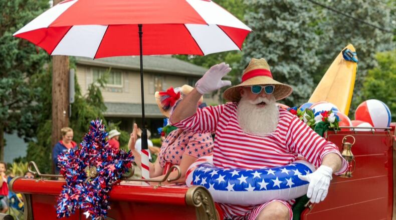 Tim Taylor, 62, plays Santa Claus and built and decorated his own sleigh for appearances such as a recent Fourth of July parade. CONTRIBUTED