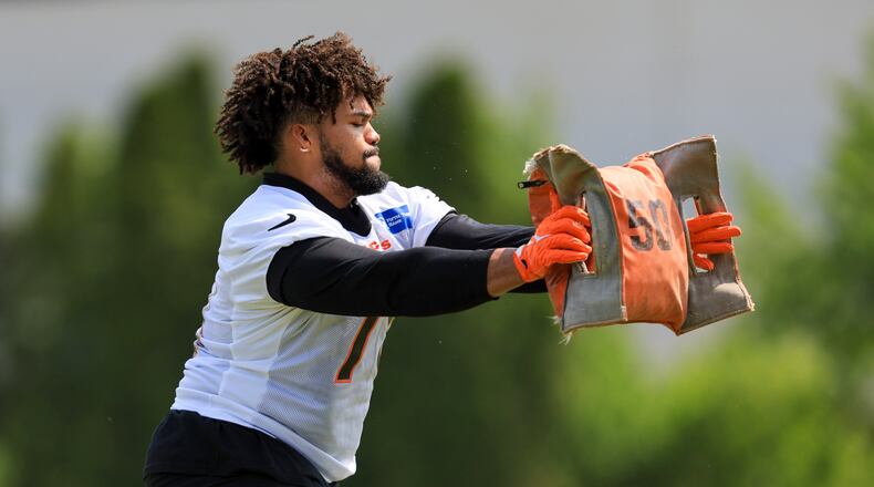 Cincinnati Bengals' Jackson Carman takes part in a drill during NFL football practice in Cincinnati, Tuesday, May 23, 2023. (AP Photo/Aaron Doster)