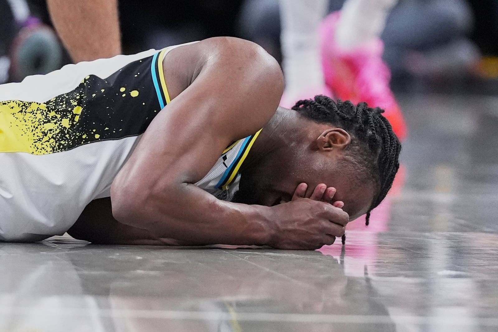 Indiana Pacers forward Aaron Nesmith reacts after a collision in the second half of Game 4 against the Cleveland Cavaliers in the Eastern Conference semifinals of the NBA basketball playoffs in Indianapolis, Sunday, May 11, 2025. (AP Photo/Michael Conroy)