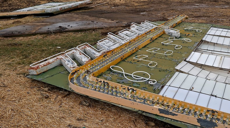 The sign in front of the Melody drive-in was the last thing to come down. The sign, which stood along U.S. 40 for decades, was disassembled and waiting to be moved and preserved Thursday, Feb. 16, 2023. BILL LACKEY/STAFF