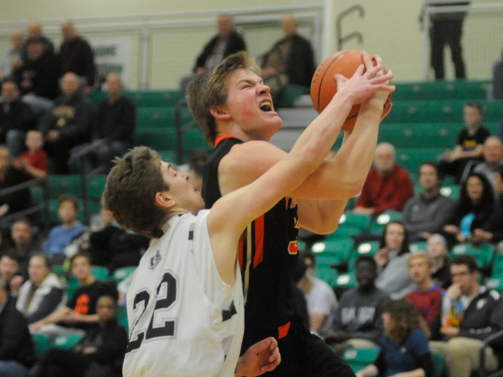 A.J. Ahrens (with ball), Justin's twin brother, is the Tigers' second-leading scorer (10.0). MARC PENDLETON / STAFF