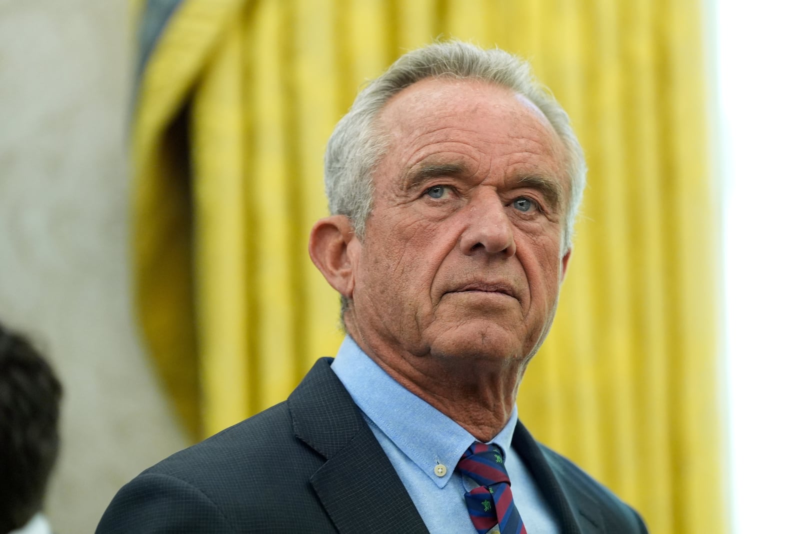 Health and Human Services Secretary Robert F. Kennedy Jr. attends a swearing in ceremony for Dr. Mehmet Oz to be Administrator of the Centers for Medicare and Medicaid Services, in the Oval Office of the White House, Friday, April 18, 2025, in Washington. (AP Photo/Alex Brandon)