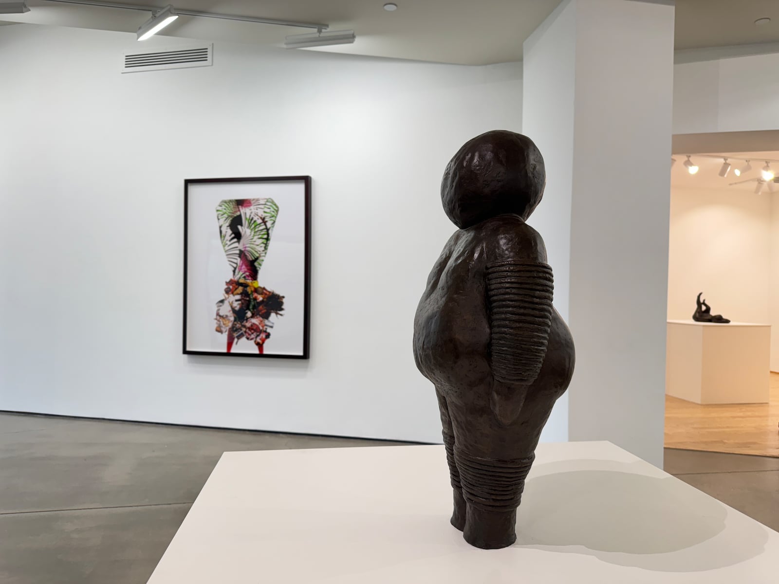 One of Xaveria Simmons' bronze figures and a photograph in the background. The artist works in a diverse range of media and is interested in the art historical figure. CONTRIBUTED