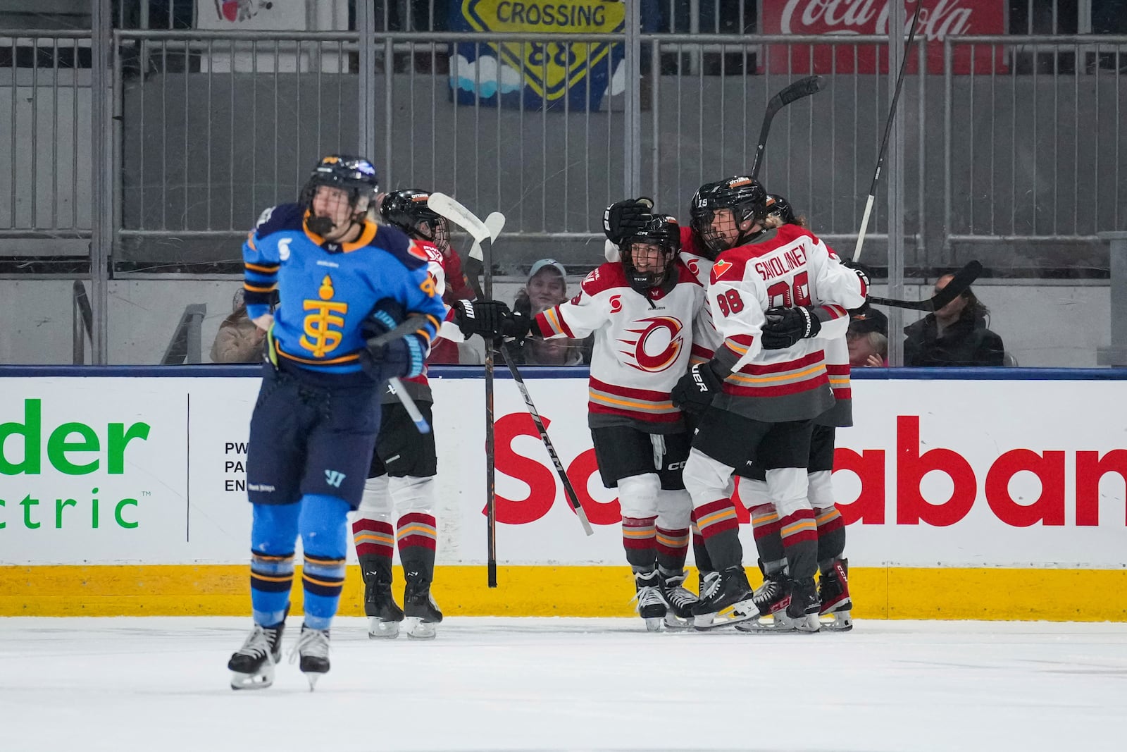 Ottawa Charge's Brianne Jenner (19) is congratulated by teammates after scoring a goal against the Toronto Sceptres during the secoond period of a PWHL hockey game in Toronto, Saturday, May 3, 2025. (Arlyn McAdorey/The Canadian Press via AP)