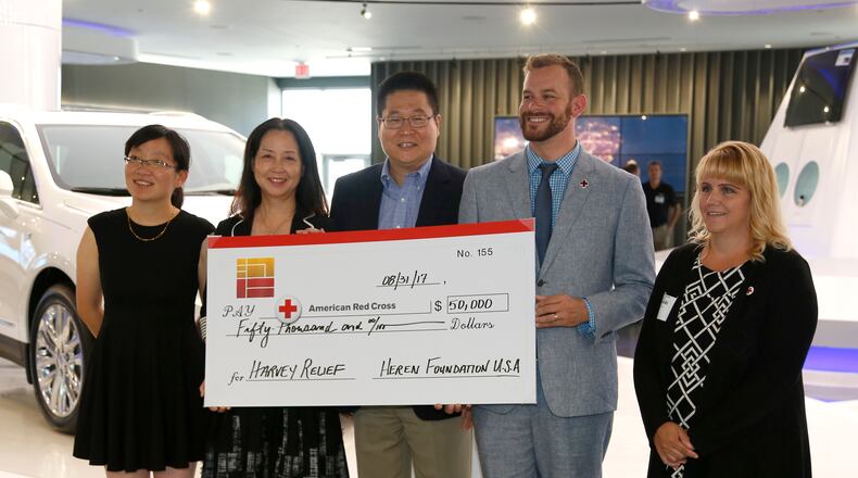 The Heren Foundation America, the charitable arm of Fuyao Global and Fuyao founder Cho Tak Wong, announced a $50,000 donation to the Dayton Area Chapter of the American Red Cross Thursday. From left to right are Lei Shi, the executive assistant of Heren Foundation America, Sunny Sun, vice-president with Fuyao and chair of the foundation board, Jeff Liu, president of Fuyao Glass America, Cory Paul, executive director of the Red Cross Dayton chapter and Laura Shepherd, regional philanthropy officer with the Red Cross. LISA POWELL / STAFF