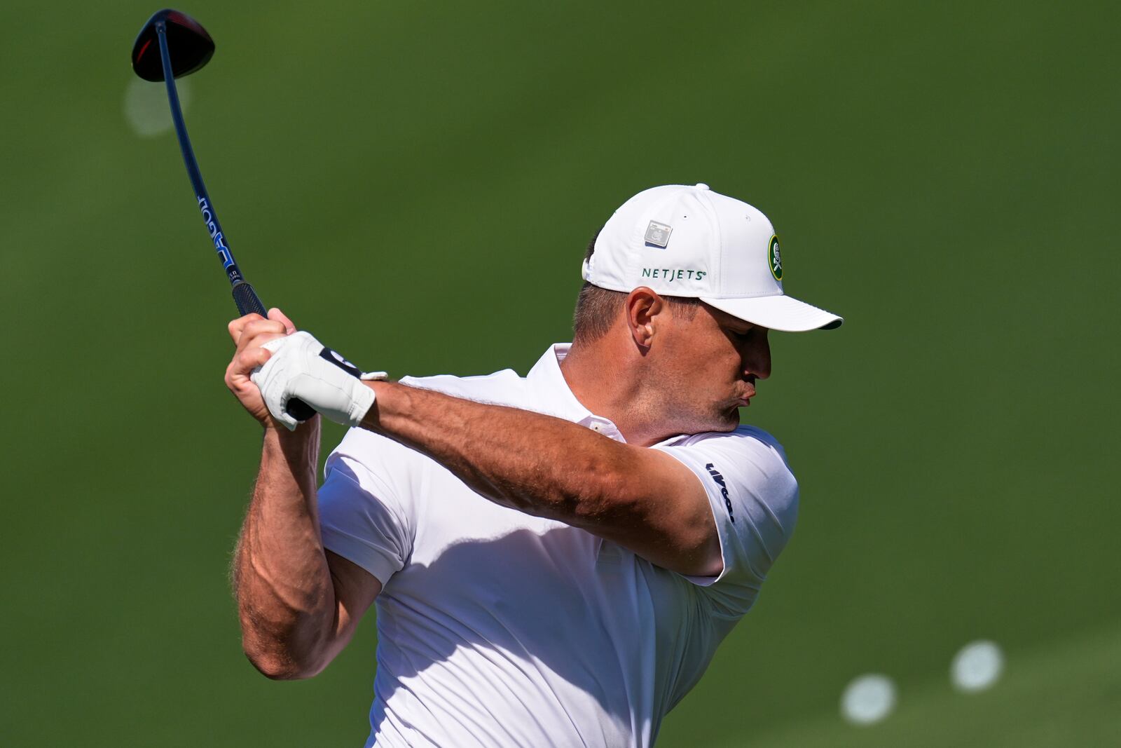 Bryson DeChambeau hits from the driving range during a practice round at the Masters golf tournament, Tuesday, April 8, 2025, in Augusta, Ga. (AP Photo/George Walker IV)