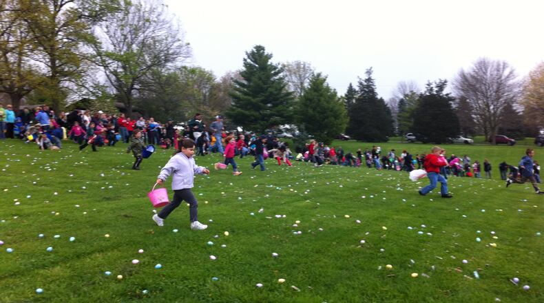 Children scour for candy during Fairfield’s annual Hoppin’ at Harbin Easter egg hunt at Harbin Park in 2012. CONTRIBUTED
