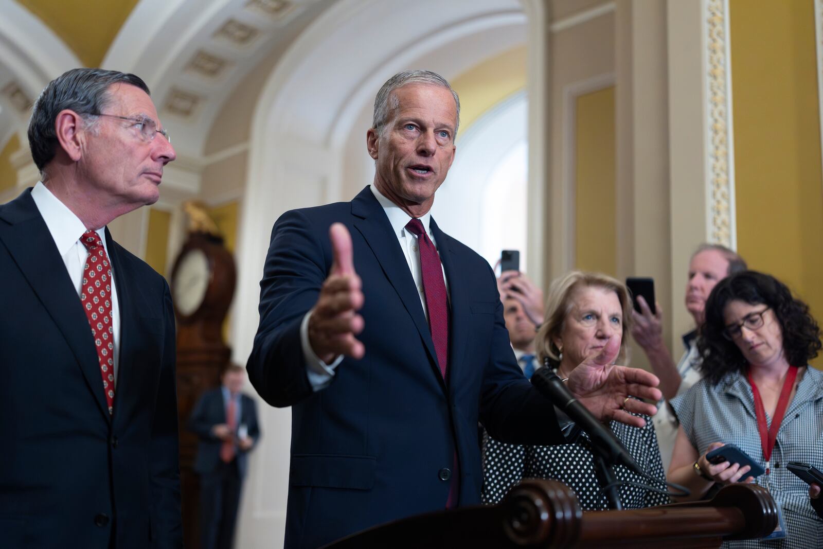 Senate Majority Leader John Thune, R-S.D., joined at left by Sen. John Barrasso, R-Wyo., the GOP whip, speaks to reporters following closed-door strategy meetings, at the Capitol in Washington, Tuesday, July 22, 2025. (AP Photo/J. Scott Applewhite)