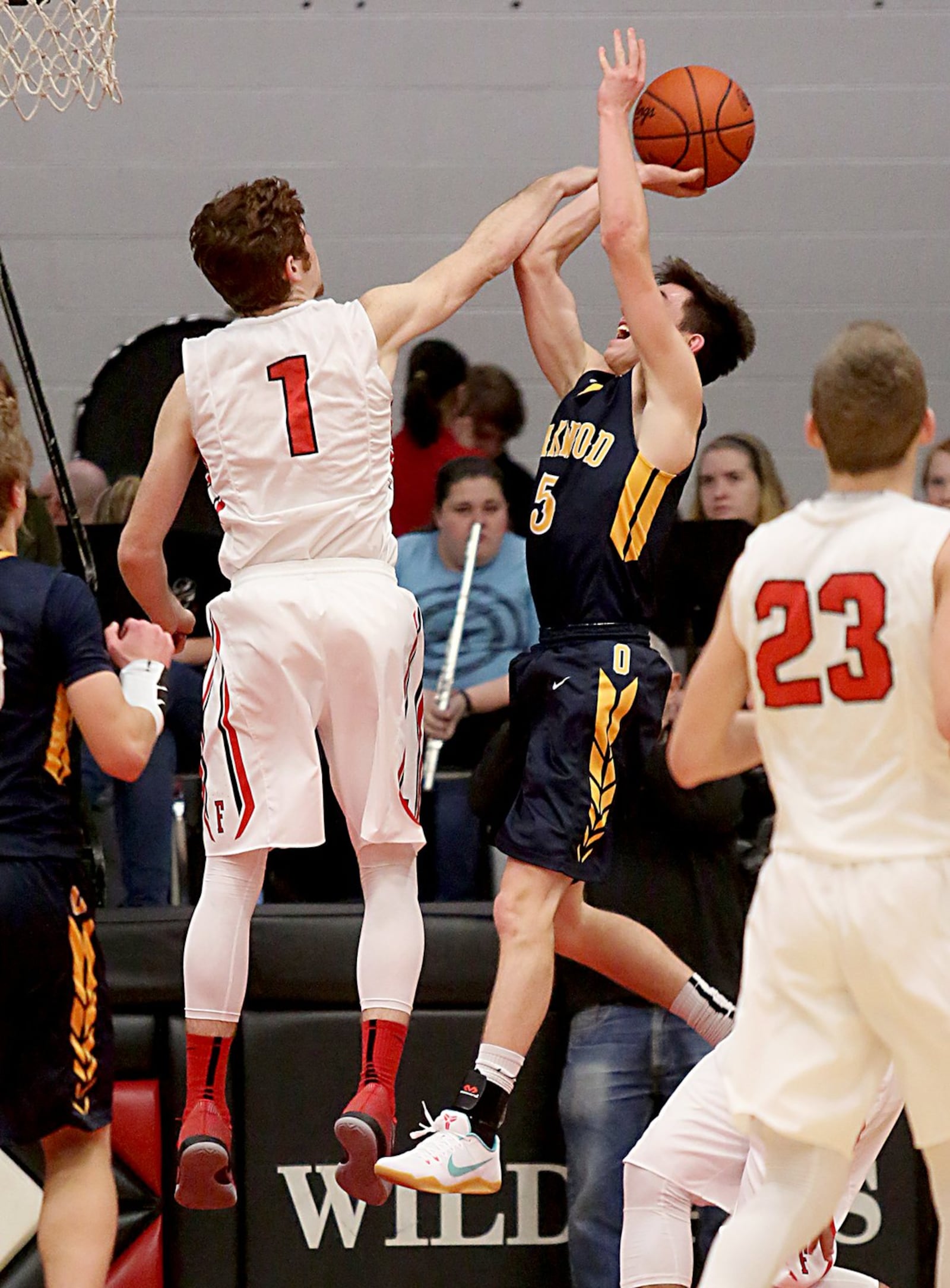Franklin’s Noah Kremer goes after a shot by Oakwood’s Brendan Talarczyk during Tuesday night’s game at Darrell Hedric Gymnasium in Franklin. That’s the Wildcats’ Jared Kinzer (23) watching the play. CONTRIBUTED PHOTO BY E.L. HUBBARD