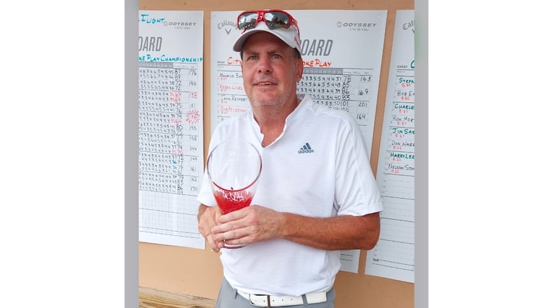 Kevin Flynn poses for a photo with the trophy after winning the Dayton Senior Championship in August 2022. Contributed photo