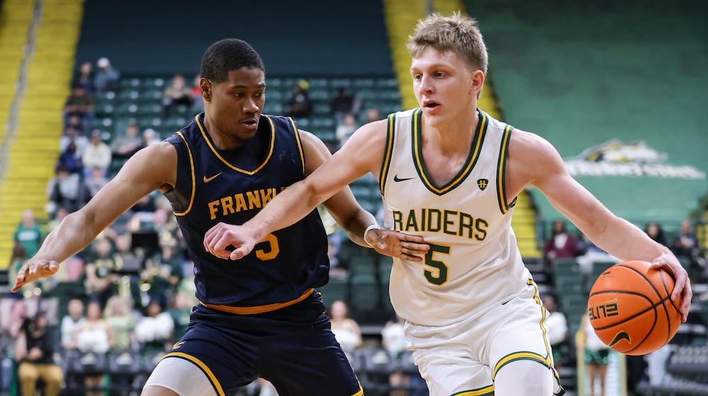 Wright State freshman forward Alex Bruskotter dribbles with pressure from Franklin College's Braylon Russell during a season opener on Monday, Nov. 3 at Ervin J. Nutter Center in Fairborn. BRYANT BILLING/STAFF