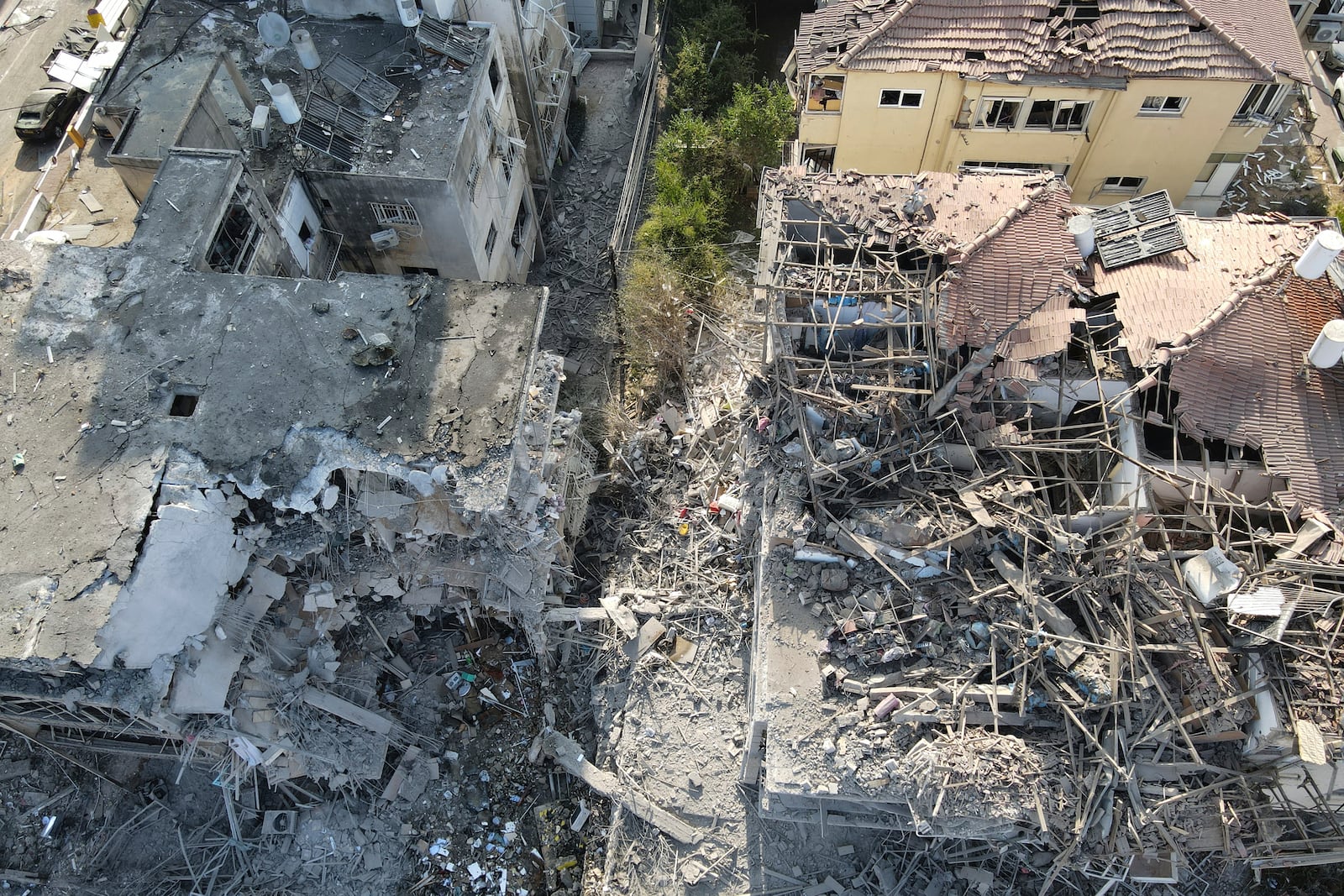 Destroyed residential buildings that was hit by a missile fired from Iran is seen in Ramat Gan, near Tel Aviv, Israel on Saturday, June 14, 2025. (AP Photo/Ariel Schalit)