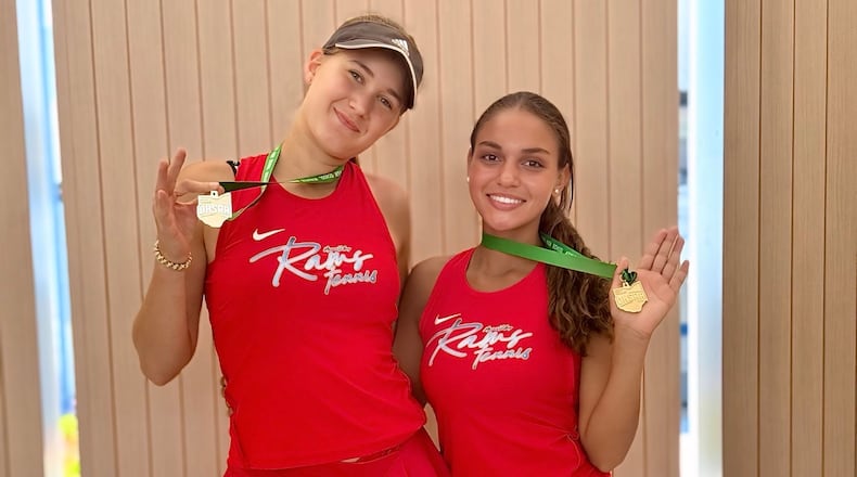 Kennedi Washington and Tamma De Boer stand together with medals after a recent competition. BUDDY PITTS JR.