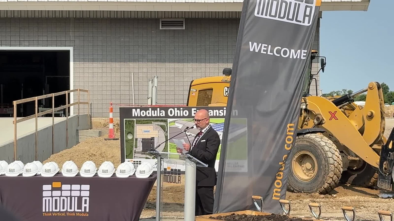 Orfero Finocchi, CEO of Modula USA based in Franklin, speaks during Tuesday, June 3, 2025, groundbreaking ceremony marking the company's more than $36 million addition to double production and capacity. Modula manufactures automated, vertical storage systems in the former Dayton Daily News printing plant visible from Interstate 75. JEN BALDUF/STAFF
