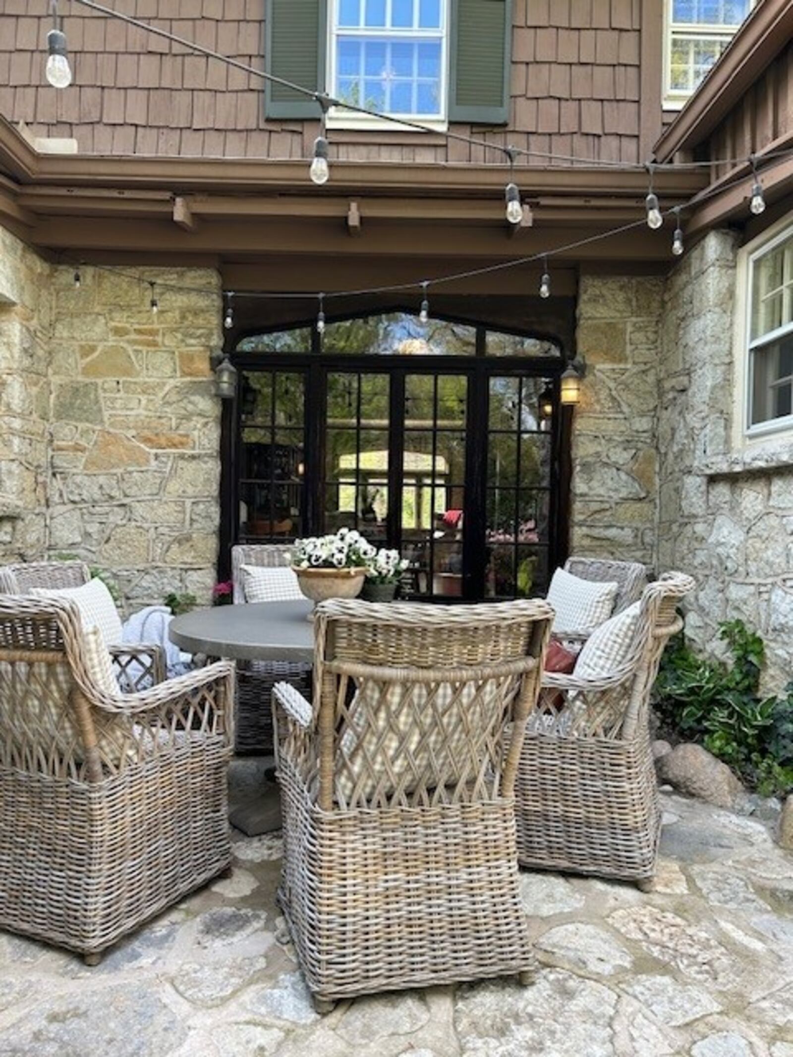 One of Sarena Kelley’s first projects at her Oakwood home was this patio, using stones that match the house. It creates one of the “vignettes” that Kelley says are key to creating great outdoor parties. JANA COLLIER/CONTRIBUTED 