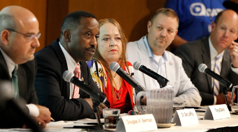 Over 300 people attended a forum to discuss marijuana issues Wednesday evening at Sinclair Community College. The event, Marijuana: Dayton Decides was sponsored by Cox Media Group Ohio and the League of Women Voters of the Greater Dayton area. The forum panelists were (left to right) Douglas Berman, Ohio State law professor; Dr. Gary LeRoy, Wright State University Boonshoft School of Medicine; Tonya Davis, a medical marijuana advocate; Ian James, executive director of Responsible Ohio and Chris Kershner, vice preident, Dayton Area Chamber of Commerce. LISA POWELL / STAFF