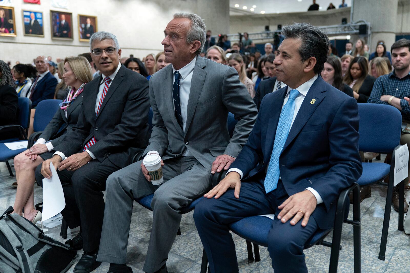 From left, Director of the National Institutes of Health Jay Bhattacharya, Health and Human Services Secretary Robert F. Kennedy Jr. and Food and Drug Administration (FDA) commissioner Marty Makary, during a news conference on the FDA's intent to phase out the use of petroleum-based synthetic dyes in the nation's food supply at the Hubert Humphrey Building Auditorium in Washington, Tuesday, April 22, 2025. (AP Photo/Jose Luis Magana)