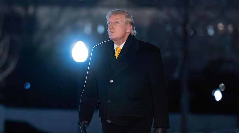 President Donald Trump walks on the South Lawn upon his arrival to the White House, Monday, Feb. 9, 2026, in Washington. (AP Photo/Jose Luis Magana)