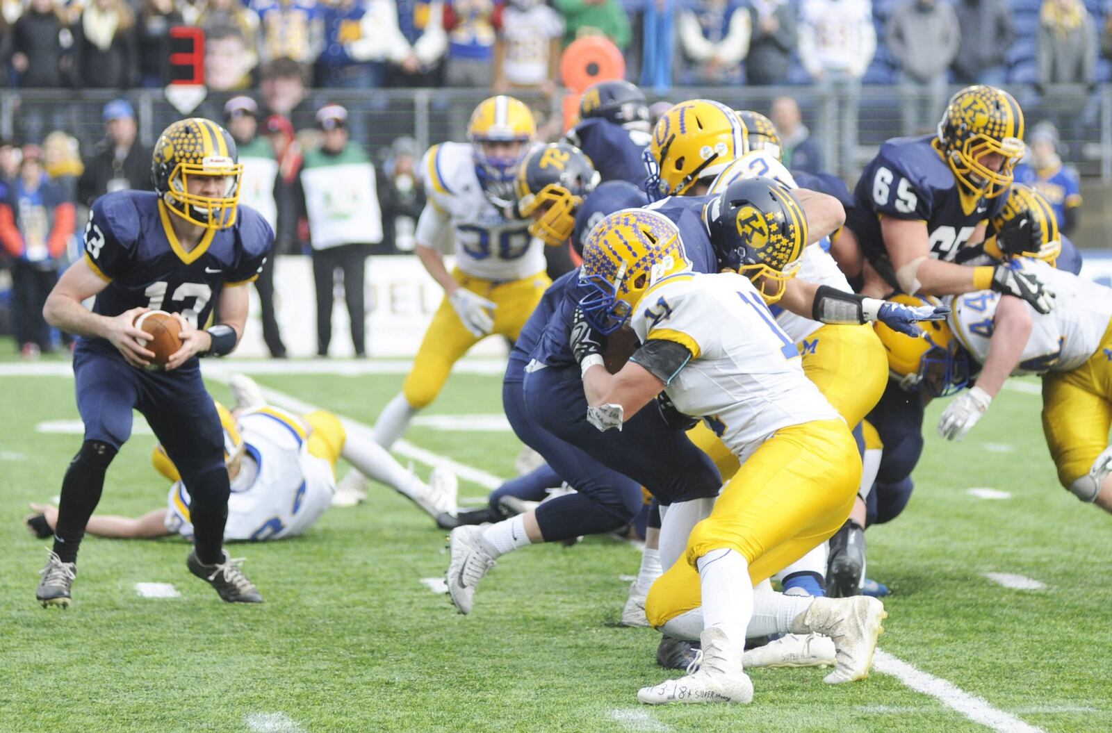 Marion Local’s Sam Huelsman takes on a Kirtland blocker. Kirtland defeated Marion Local 16-7 in the D-VI high school football state championship at Canton’s Tom Benson Hall of Fame Stadium on Friday, Nov. 30, 2018. MARC PENDLETON / STAFF