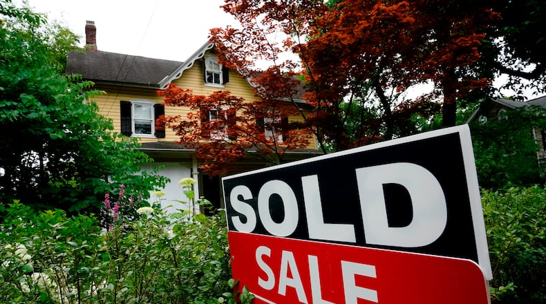 FILE - A sale sign stands outside a home in Wyndmoor, Pa., Wednesday, June 22, 2022. On Friday, the National Association of Realtors reports on sales of existing homes in December. (AP Photo/Matt Rourke, File)