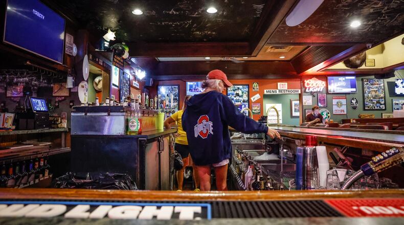 Little York Tavern & Pizza bartender Alexandria Back readies the barroom for a busy Friday afternoon. The Little York Tavern applied for sports gambling kiosks. JIM NOELKER/STAFF