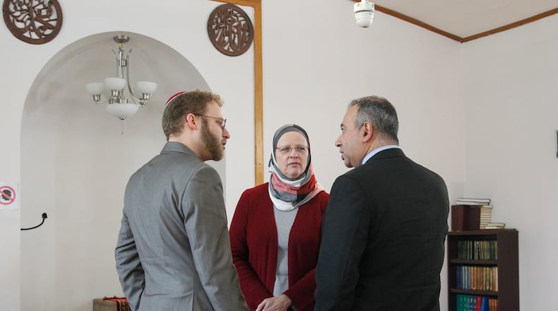 Rabbi Ari Ballaban, director of the Jewish Community Relations Council, Karen Dabdoub, executive director of the Council on American-Islamic Relations-Cincinnati, and Ayman Salem, vice chairman of the Islamic Society of Greater Dayton, discuss a vandalism incident at the Al-Rahman Mosque in late February. CHRIS STEWART / STAFF