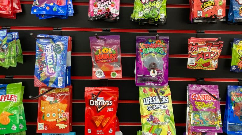 FILE - Products advertised as containing synthetically derived delta-8 THC are offered for sale at a smoke shop in north Seattle on Feb. 25, 2022. (AP Photo/Gene Johnson, File)