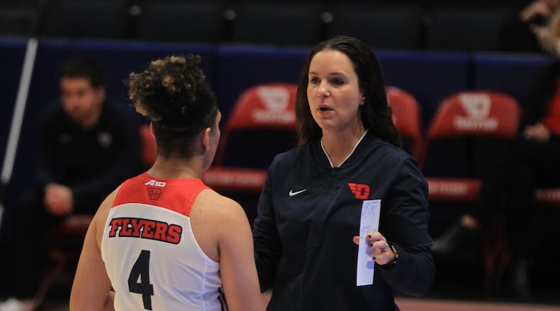Dayton's Shauna Green talks to Capria Brown during a game against Toledo on Wednesday, Nov. 17, 2021, at UD Arena. David Jablonski/Staff