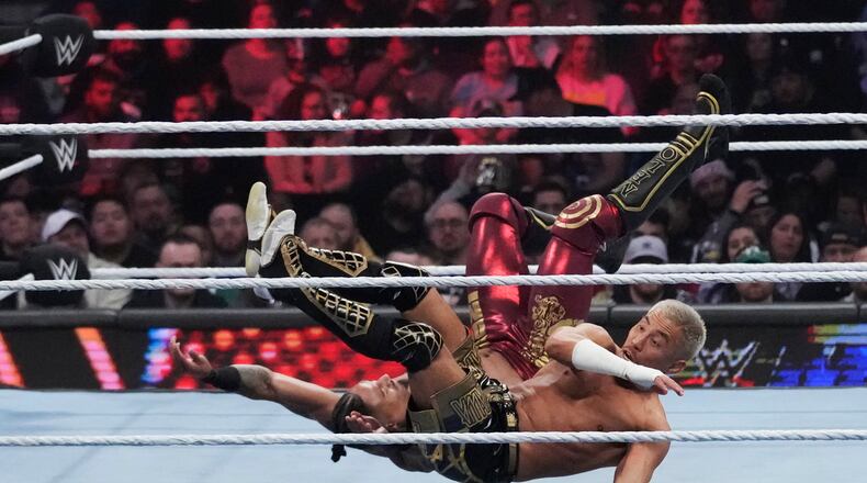 FILE - Wrestler Carmelo Hayes, top, tangles with Akira Tozawa during the WWE Monday Night RAW event, March 6, 2023, in Boston. This year's WrestleMania may be just days away, but the marketing run up to WWE's biggest premium live event went into overdrive months ago. (AP Photo/Charles Krupa, File)