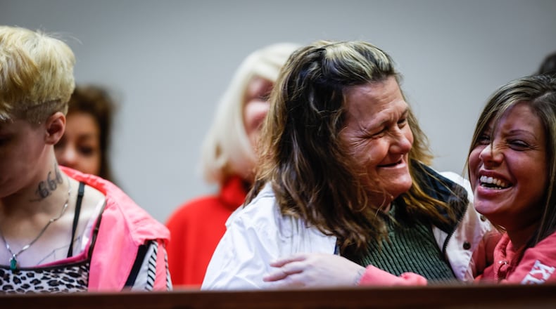 From left, Jessica Lochner, Lyneia Blanken and Alexandria Lewis, celebrate recovery at the new R.IS.E. program at the Montgomery County Pleas Court Wednesday March 6, 2022. JIM NOELKER/STAFF