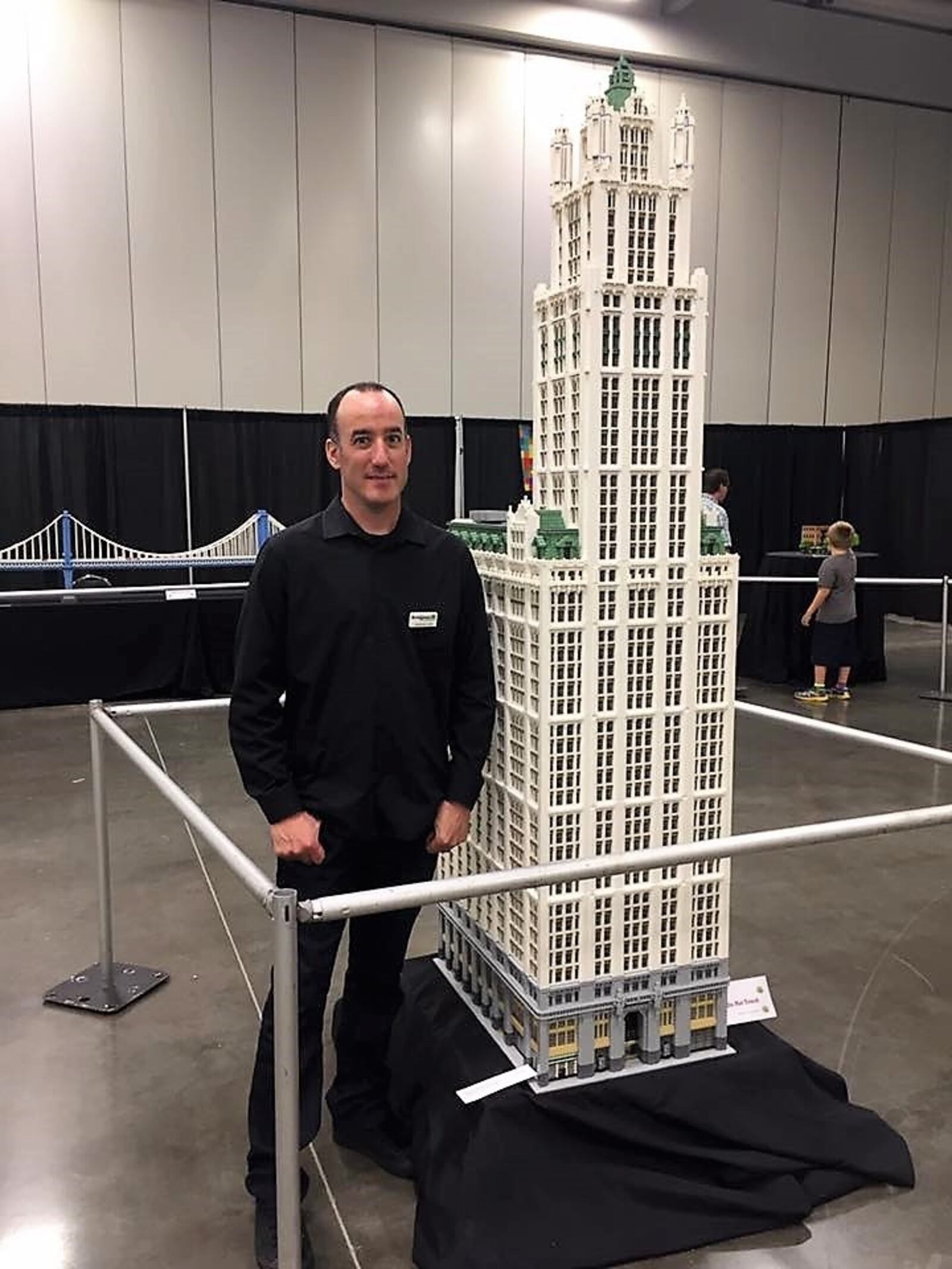 LEGO artist Jonathan Lopes poses with the Woolworth Building he built with 120,000 bricks. Lopes will be at this weekends LEGO BrickUniverse Convention in Dayton. CONTRIBUTED