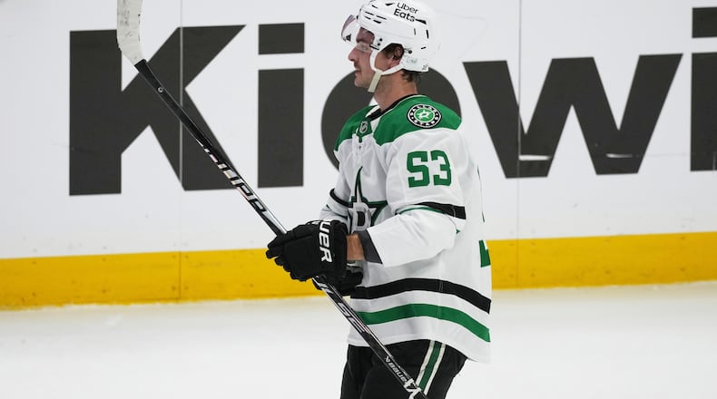 Dallas Stars center Wyatt Johnston reacts after scoring the winning goal during a shootout in an NHL hockey game against the Colorado Avalanche, Wednesday, March 18, 2026, in Denver. (AP Photo/David Zalubowski)