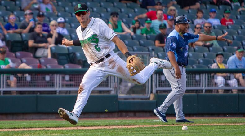 Dragons third baseman Tyler Callihan overruns a bunt during the first game of a doubleheader Thursday against West Michigan. The ball got too far away from Callihan and a runner scored from third in the 7-3 loss.