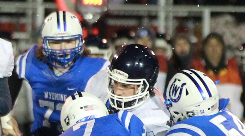 Valley View QB Cade Cradlebaugh is swarmed by Wyoming defenders. Cincinnati Wyoming defeated Valley View 33-0 in a D-IV, Region 16 high school football final at Princeton on Saturday, Nov. 23, 2019. MARC PENDLETON / STAFF