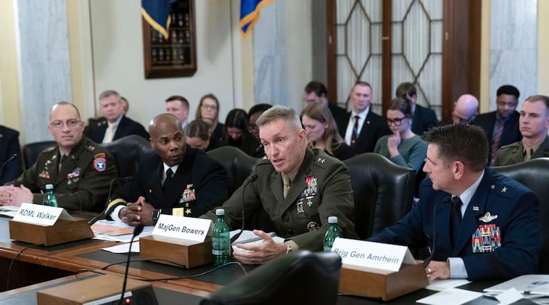 From left, Major General Johnny K. Davis, USA, Commanding General, United States Army Recruiting Command; Rear Admiral Alexis T. Walker, USN, Commander, Navy Recruiting Command; Major General William J. Bowers, USMC, Commanding General, Marine Corps Recruiting Command and Brigadier General Christopher R. Amrhein, USAF, Commander, Air Force Recruiting Service testify before the Senate Armed Services Subcommittee on Personnel hearing to examine the status of Department of Defense recruiting efforts and plans for fiscal year 2024, on Capitol Hill in Washington Wednesday, Dec. 6, 2023, (AP Photo/Jose Luis Magana)