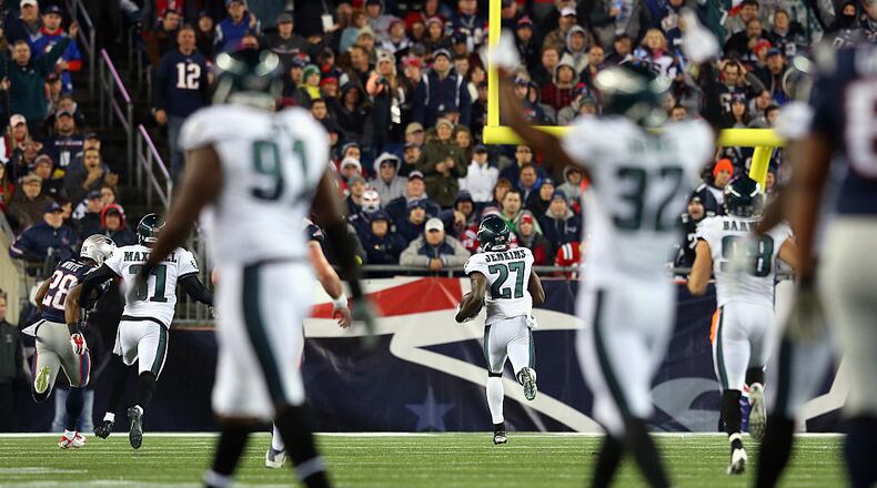 FOXBORO, MA - DECEMBER 06:  Malcolm Jenkins #27 of the Philadelphia Eagles intercepts a pass intended for Danny Amendola #80 of the New England Patriots and returns it for a touchdown during the third quarter at Gillette Stadium on December 6, 2015 in Foxboro, Massachusetts.  (Photo by Jim Rogash/Getty Images)