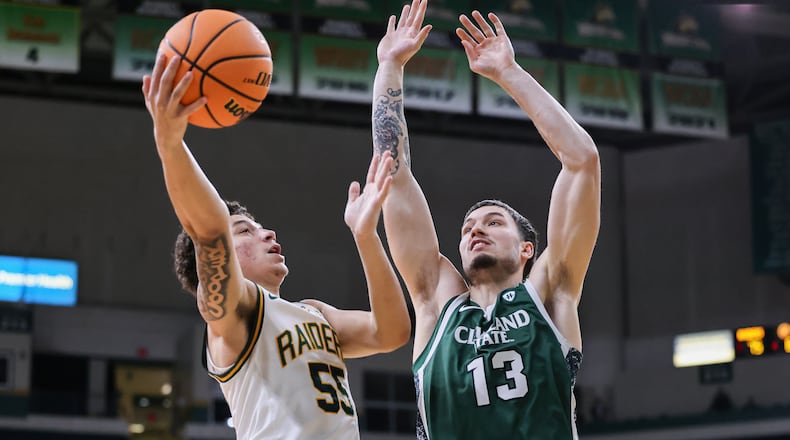 Wright State freshman guard Michael Cooper shoots with pressure from Cleveland State's Lucas Burton during a Horizon League Championship first-round game on Wednesday, March 4 at Ervin J. Nutter Center in Fairborn. Cooper scored 17 points and had seven rebounds. BRYANT BILLING / STAFF