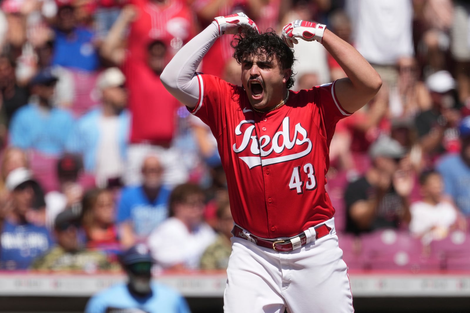 Cincinnati Reds' Sal Stewart, who is making his major league debut, reacts after scoring a run in the second inning of a baseball game against the Toronto Blue Jays, Monday, Sept. 1, 2025, in Cincinnati. (AP Photo/Kareem Elgazzar)
