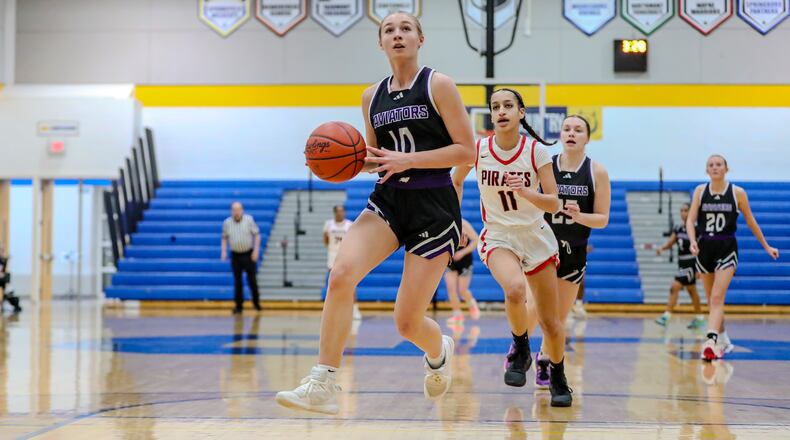 Vandalia Butler High School sophomore Nora Stammen drives the ball to the hoop during a Division III second round game against West Carrollton on Saturday afternoon at Springfield High School. MICHAEL COOPER/CONTRIBUTED
