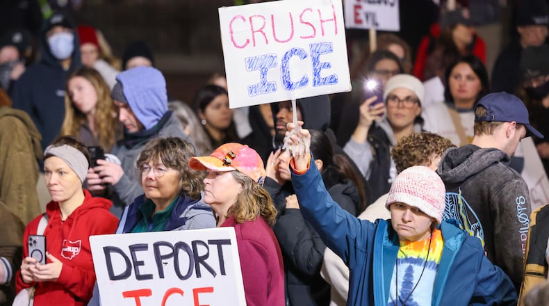 Demonstrators listen to a speaker during the Dayton to Minneapolis Stop ICE Terror protest in Courthouse Square in Dayton on Thursday, Jan. 8. The protest was organized by a local chapter of the Party for Socialism and Liberation. BRYANT BILLING/STAFF