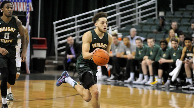 Wright State junior guard Justin Mitchell brings the ball up the court against Cleveland State on Saturday during the Raiders’ 74-68 double-overtime win at the Wolstein Center.