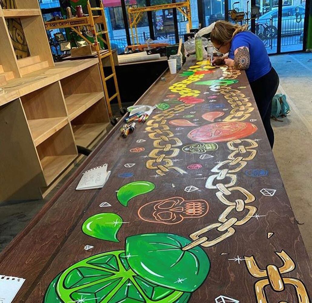PHOTOS: Wild and wacky murals take over new restaurant at The Greene
