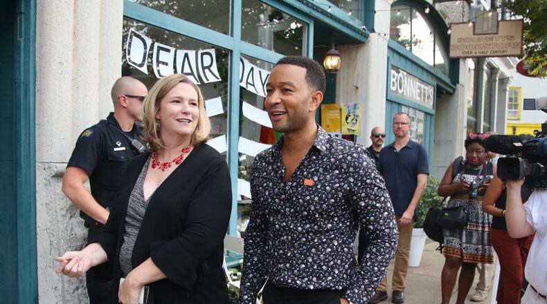 Dayton Mayor Nan Whaley and singer John Legend tour Dayton’s Oregon District on Aug. 11, 2019. Legend grew up nearby in Springfield and returned to Dayton to visit and shop in the district one week after a mass shooting claimed 10 lives. Legend later performed at a tavern for an invited audience of first responders and people affected by the shooting.