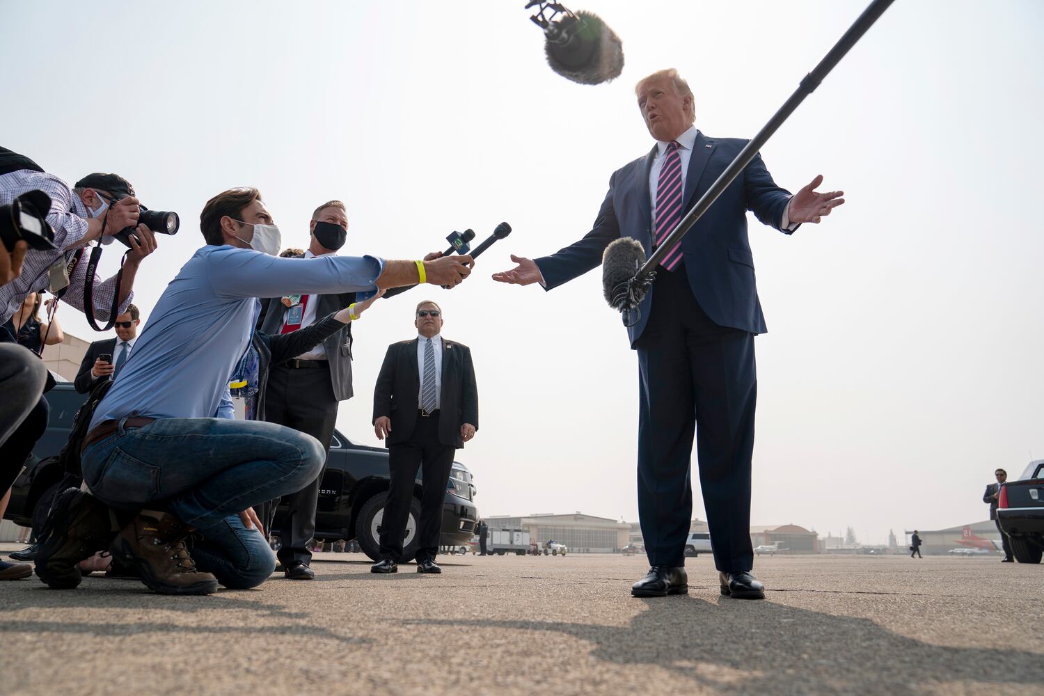 President Donald Trump speaks with reporters at Sacramento McClellan Airport in McClellan Park, Calif., Monday, Sept. 14,  2020, before attending a briefing about wildfires in California with Gov. Gavin Newsom of California, and others. (Doug Mills/The New York Times)