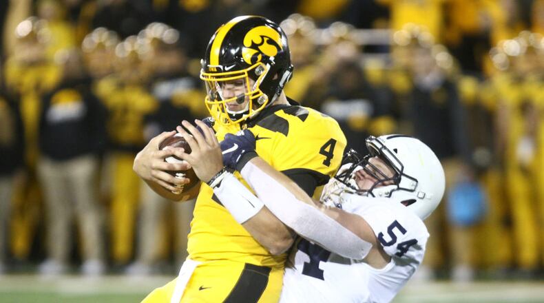 IOWA CITY, IOWA- OCTOBER 12: Quarterback Nate Stanley #4 of the Iowa Hawkeyes is sacked during the second half by defensive tackler Robert Windsor #54 of the Penn State Nittany Lions on October 12, 2019 at Kinnick Stadium in Iowa City, Iowa. (Photo by Matthew Holst/Getty Images)