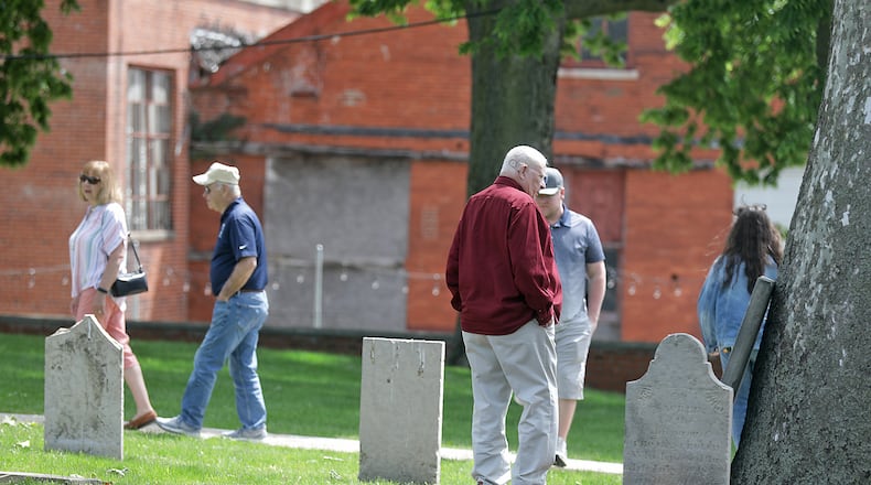 A dedication ceremony was held Saturday, May 27, 2023 for the renovated Springfield Burying Ground in downtown Springfield. The Burying Ground, opened in 1801, recently underwent a $1.2 million renovation. Several Revolutionary War veterans are buried in cemetery along with the founding fathers of Springfield. New grave markers have been added along with historic plaques and a statue of Springfield founder James Demint. BILL LACKEY/STAFF