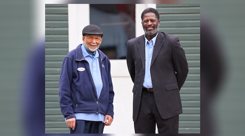 Cedric D. Howard (right) has been named a Dayton Daily News Community Gem for his work raising money as an Alzheimer's advocate. He was nominated by Chuck Johnson (left), who serves with him on the preservation Dayton board. BRYANT BILLING / STAFF